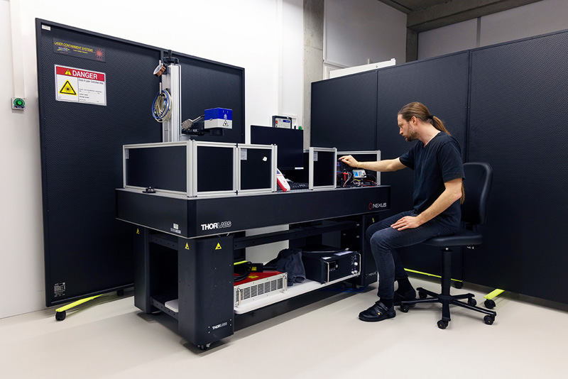 An employee working on a laser application in our in-house laser lab.