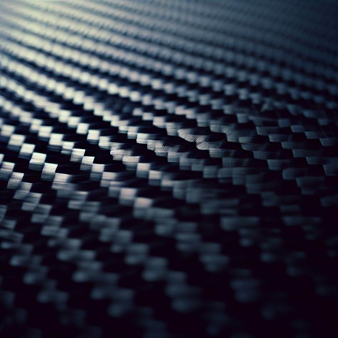 Highly detailed close-up of a carbon surface as material for laser marking.